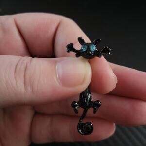 Black cat with blue eyes belly button navel piercing